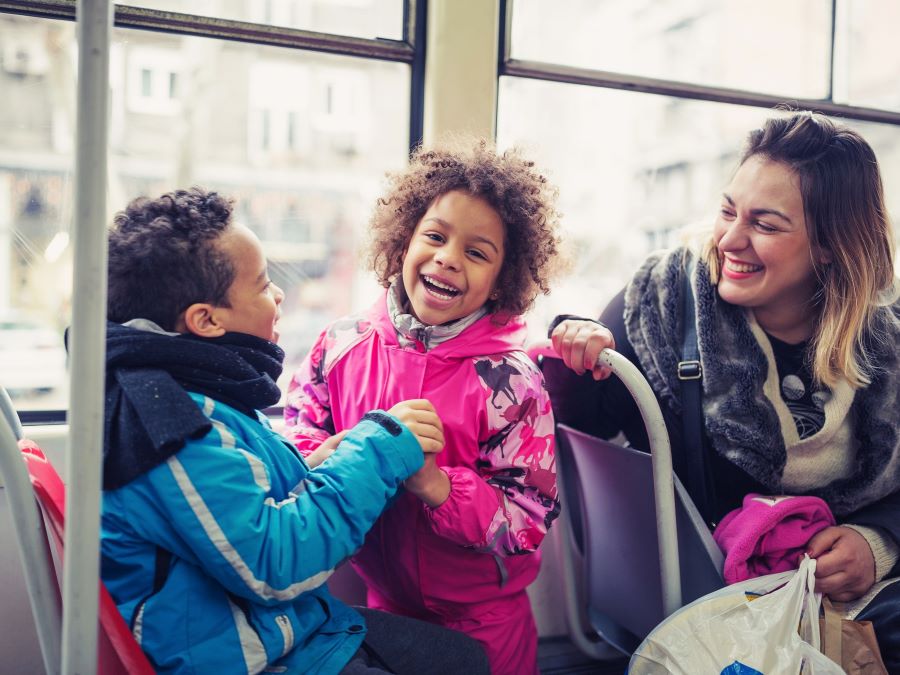 Children and mother on bus.