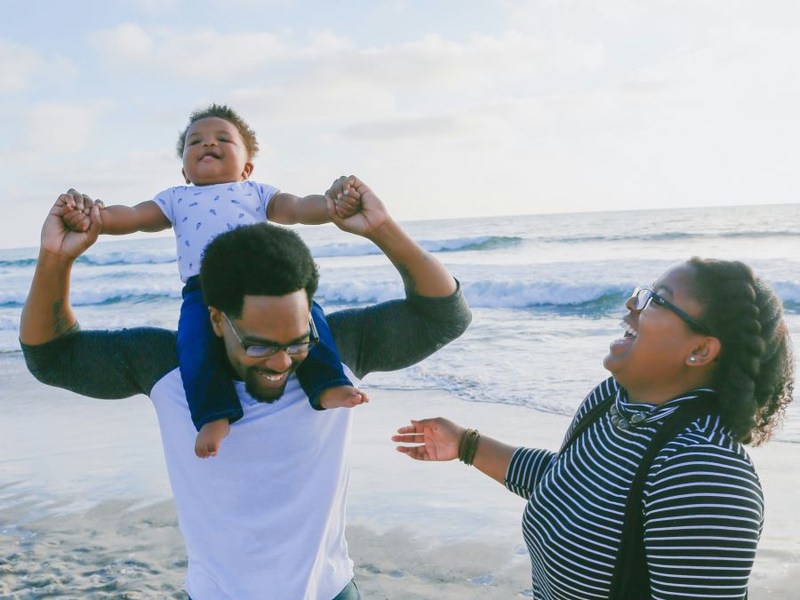 Parents and child at a beach