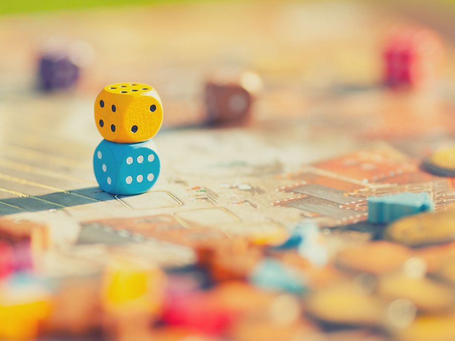 Six sided dice stacked on top of each other.