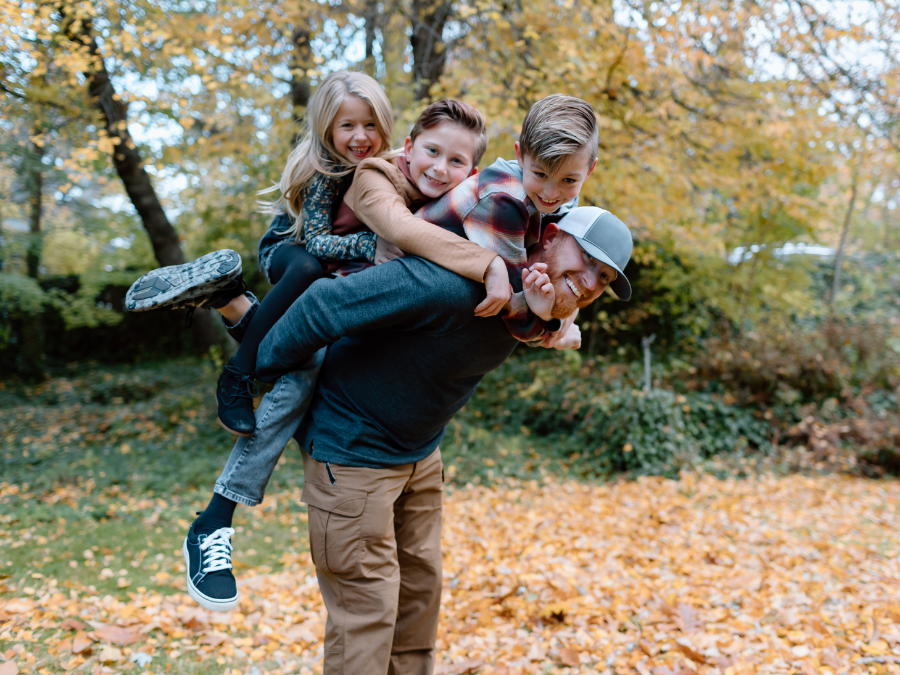 Adult and children playing outside