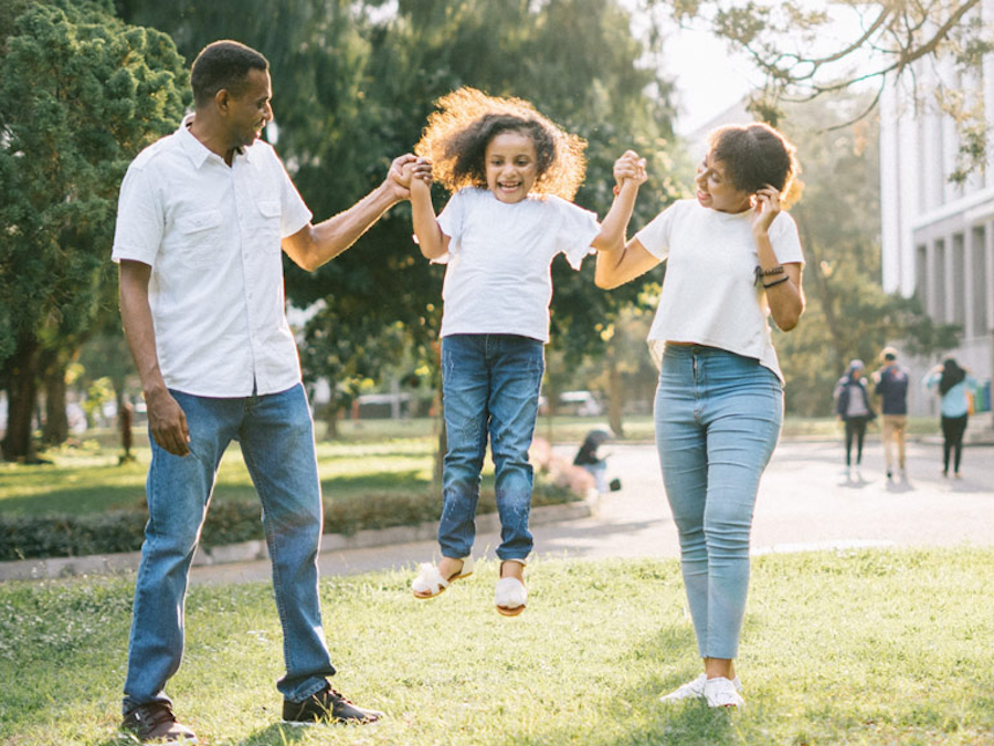 Photo of African American family playing outside